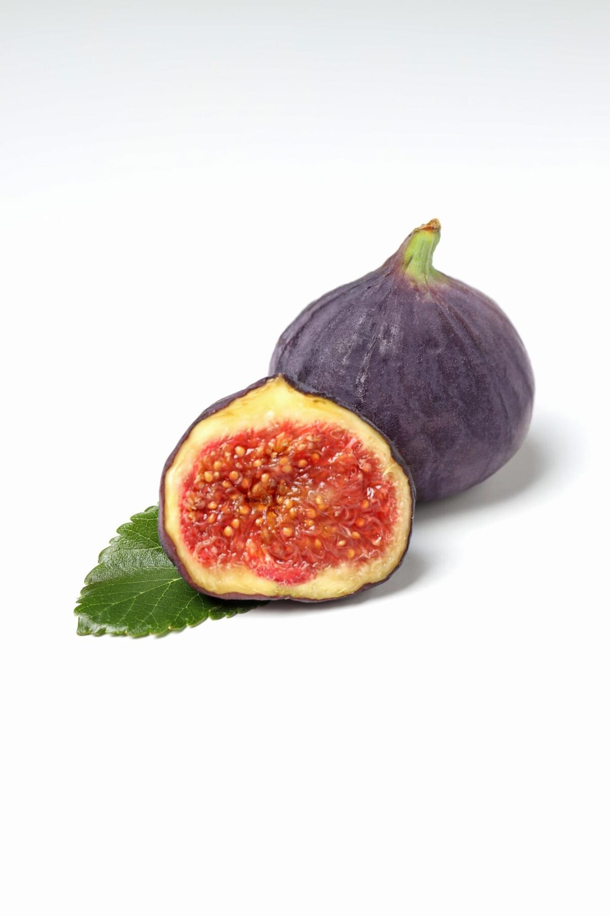 fresh ripe figs with leaves white background 185193 163612