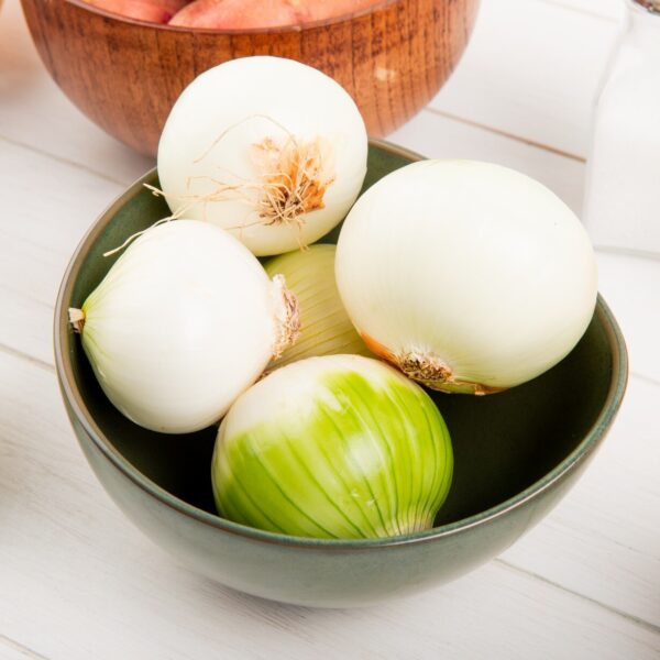 side view white onions bowl with potatoes bowl salt butter around wooden background 141793 9477